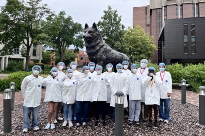 A group photo of SYP participants by the Husky statue at Michigan Tech