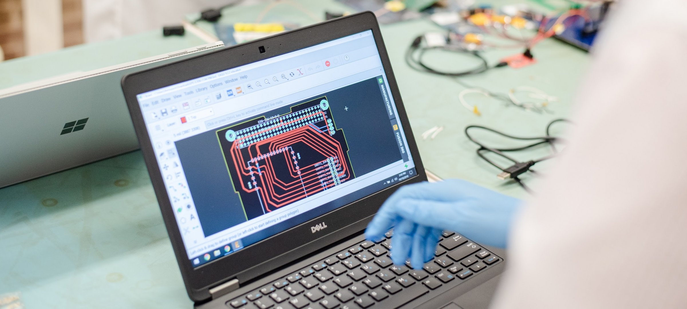 Displaying electrical software on a laptop in a lab.