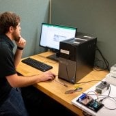 Electrical engineering student working in front of a computer