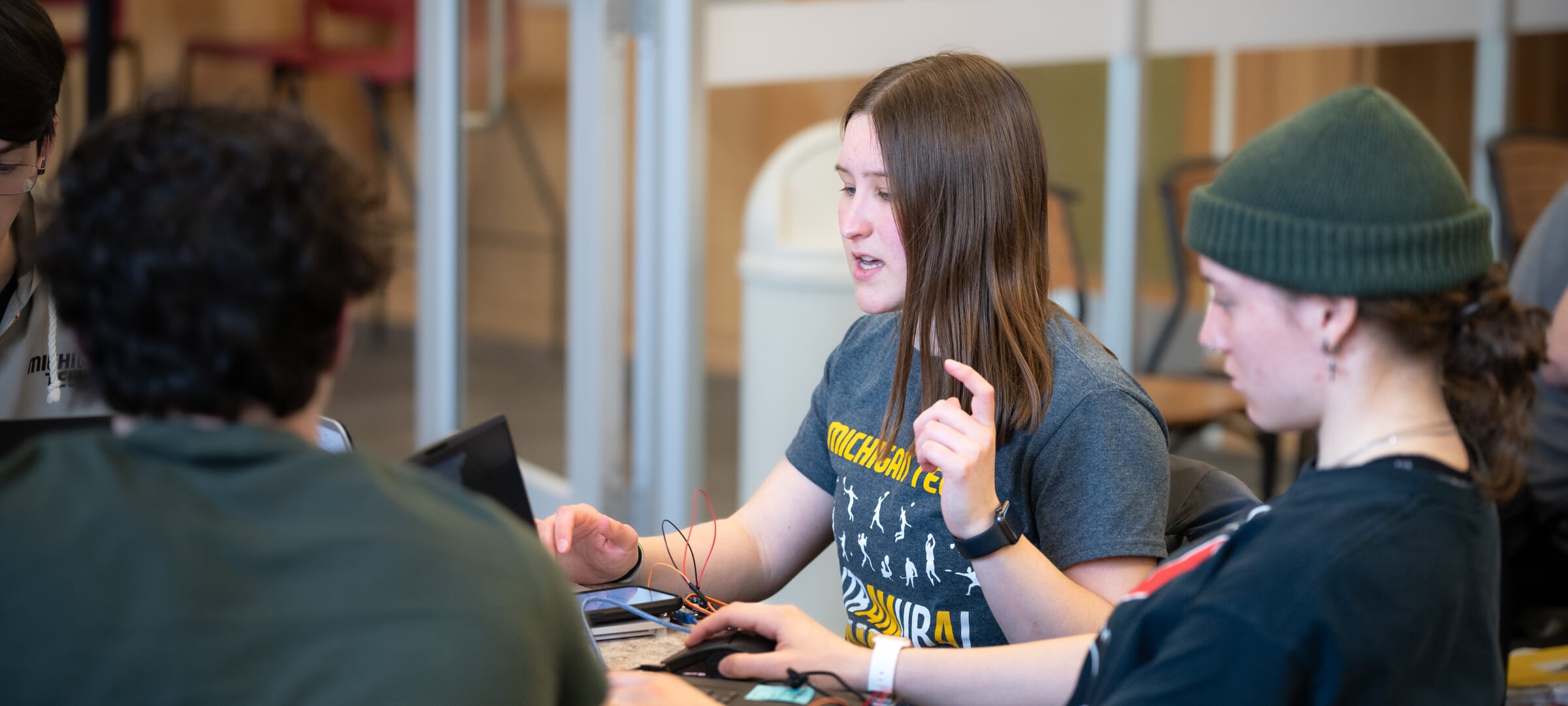 Students working on a laptop together