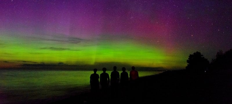 Students and aurora at the lake.