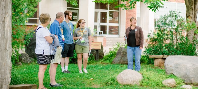 Alumni visiting the Boulder Garden on campus during reunion.