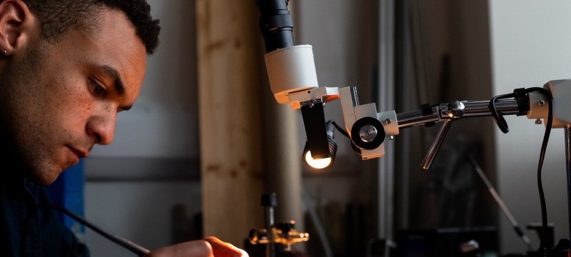 Engineer at work on a bench model.