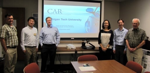 Industry partners giving a presentation in a board room.