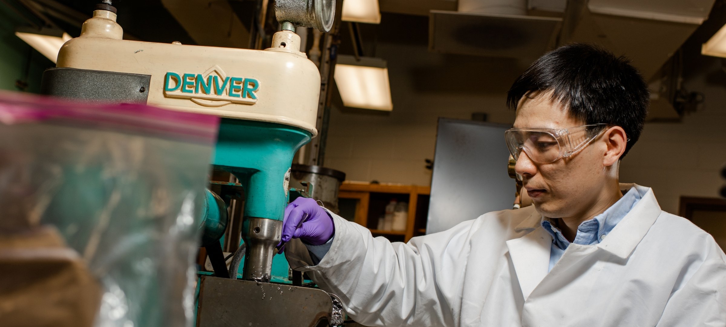 Researcher in a chemical engineering lab.