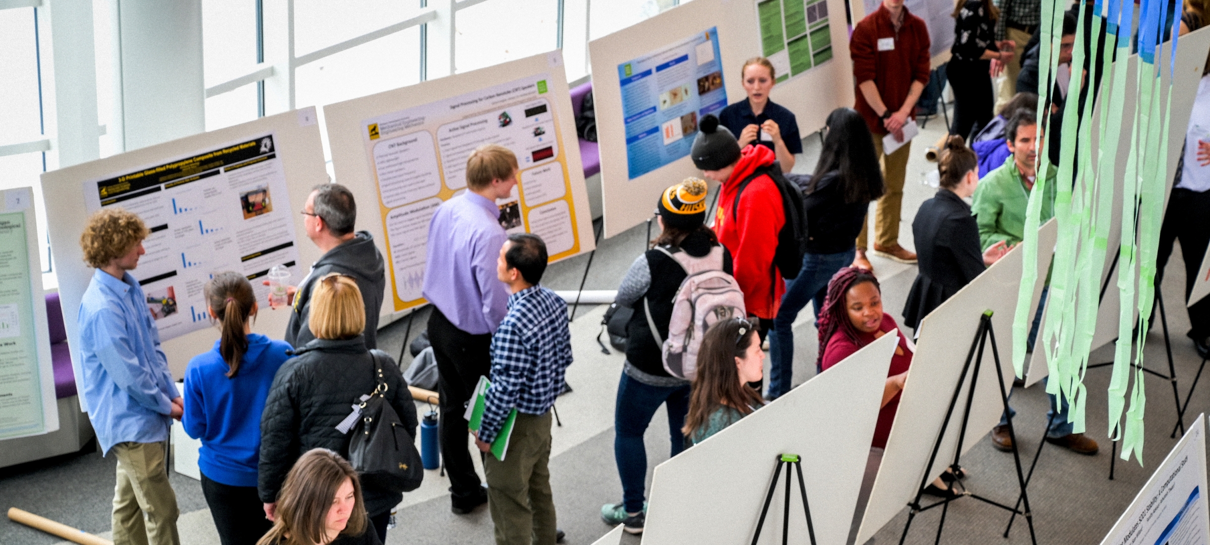 Students and faculty mix at the Undergraduate Research Symposium.