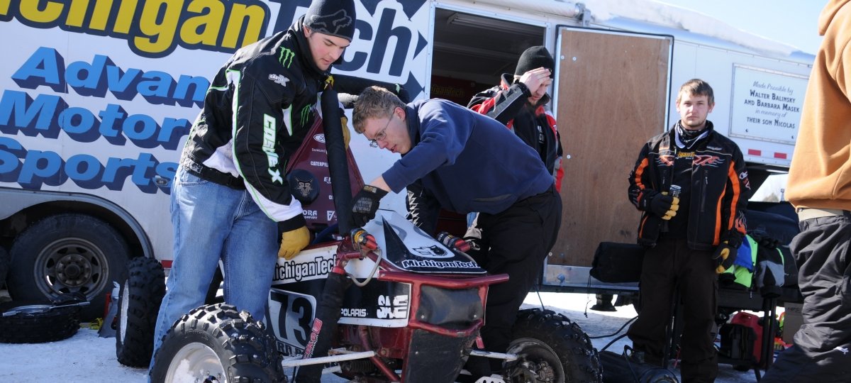 Michigan Tech students work on a baja racer