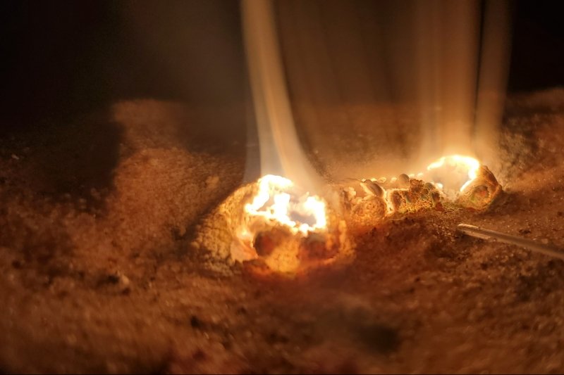 A block of magnesium alloy in a forge