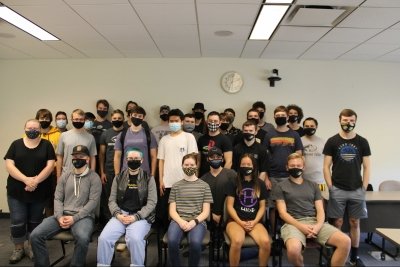 members of the hide team sitting and standing for a photo