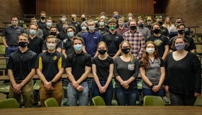 Multiplanetary INnovation Enterprise team photo in large classroom