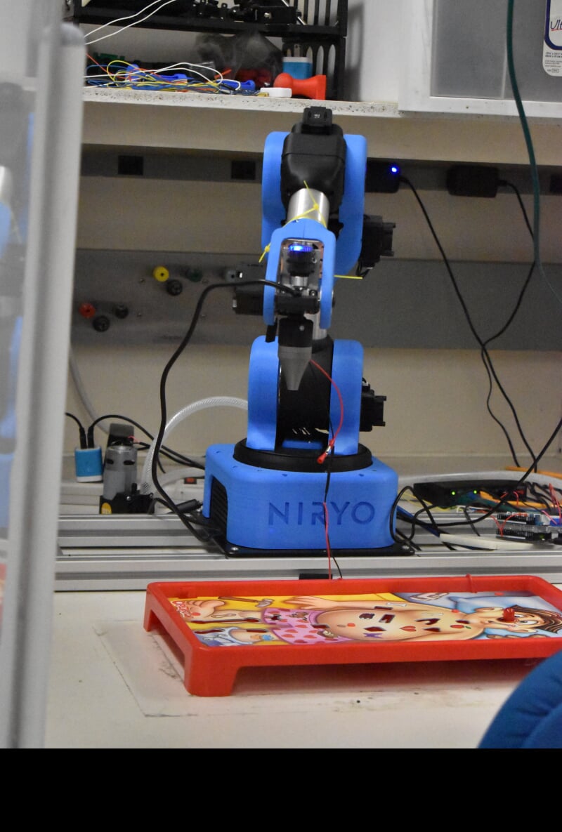 Pick-in-place robot playing the game Operation