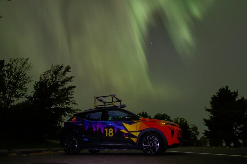RSE Team Photo and Prometheus Borealis Competition Car under Aurora Borealis