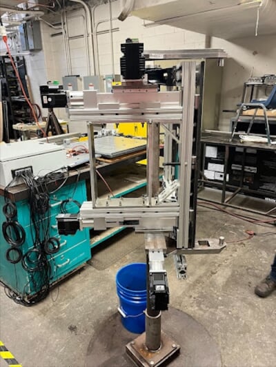 Side View of Test Fixture shown, Displaying the Linear Actuators and Hinges