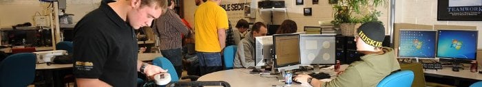 Students in a computer lab working together on an enterprise project