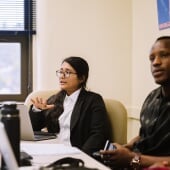 EEP Class Presentations - two students in discussion in front of a laptop