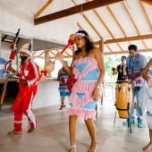 Students dancing in Suriname in bright clothing