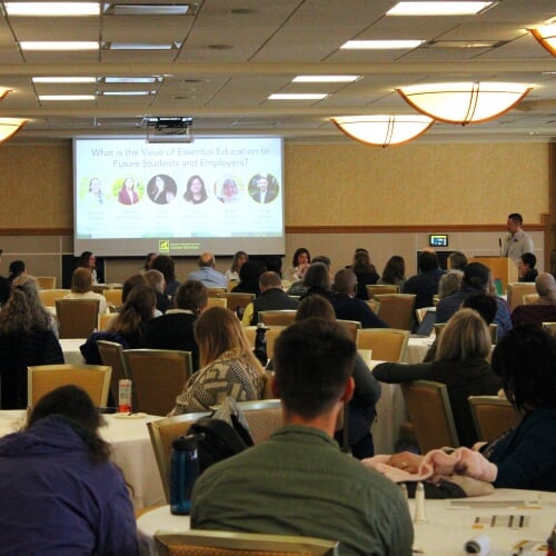 participants sitting and listening to the closing speaker