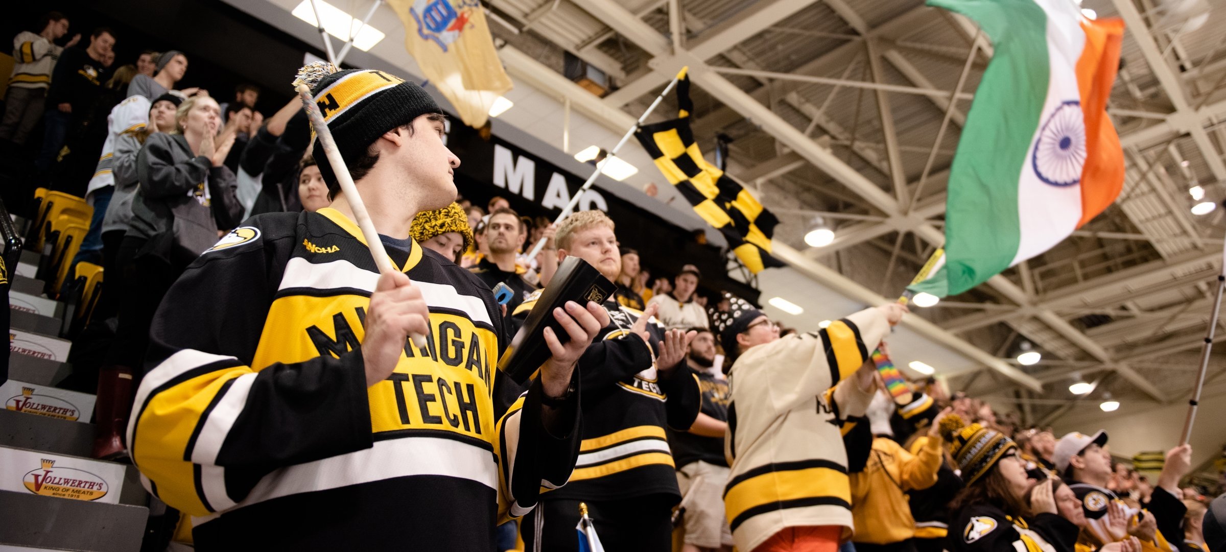 A crowd cheering for at a Michigan Tech Hockey game