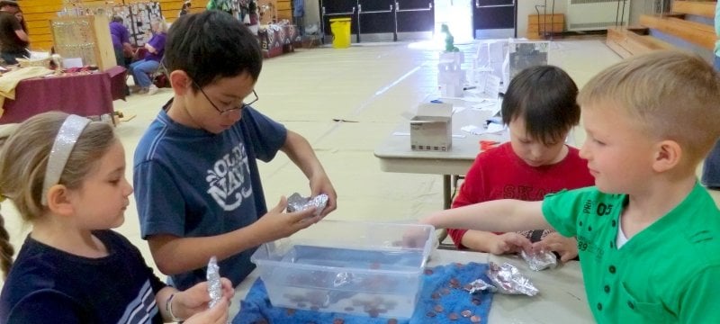 Children trying a floating experiment.