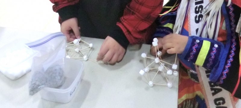 Students try out geodesic dome construction.