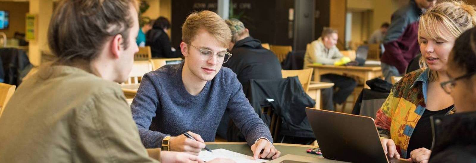 Group photo of studying at a table.