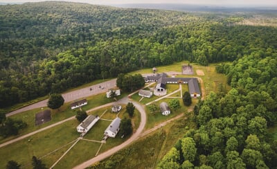 Aerial view of the Ford Center and surrounding forest.