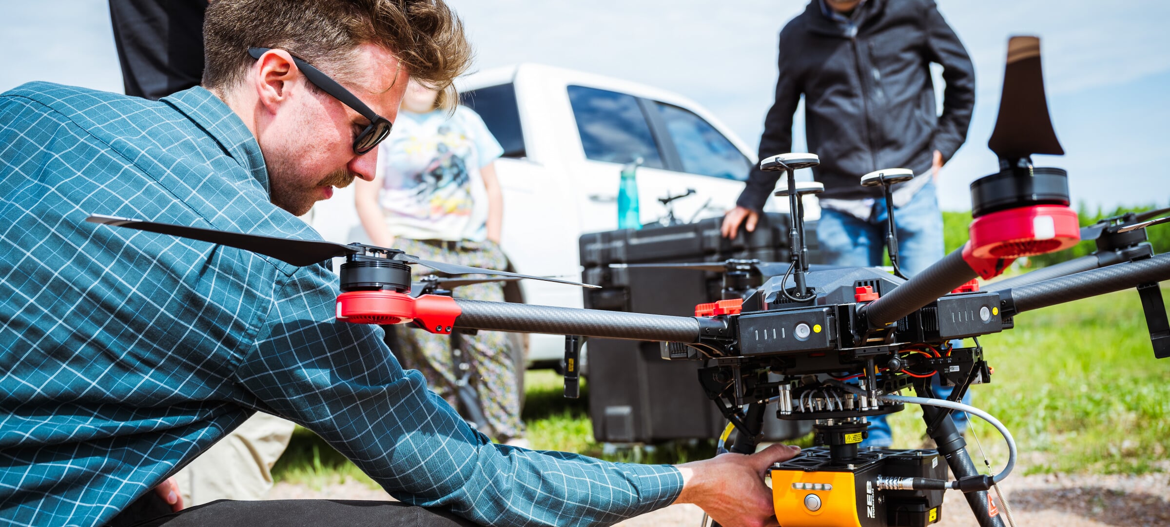 A student setting up a large drone