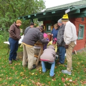 People watching the apple pressing