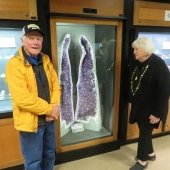 Dan and Jolayne Farrell stand next to the amethyst specimen they donated to the museum.