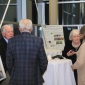 Dan Farrell and Gerald Carlson talk near a table