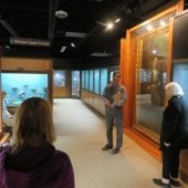 John Jaszczak speaks to group within the mineral museum