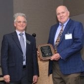 Aleksey and Richard pose with Richard's plaque