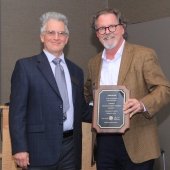 Todd Stone holds his Academy plaque