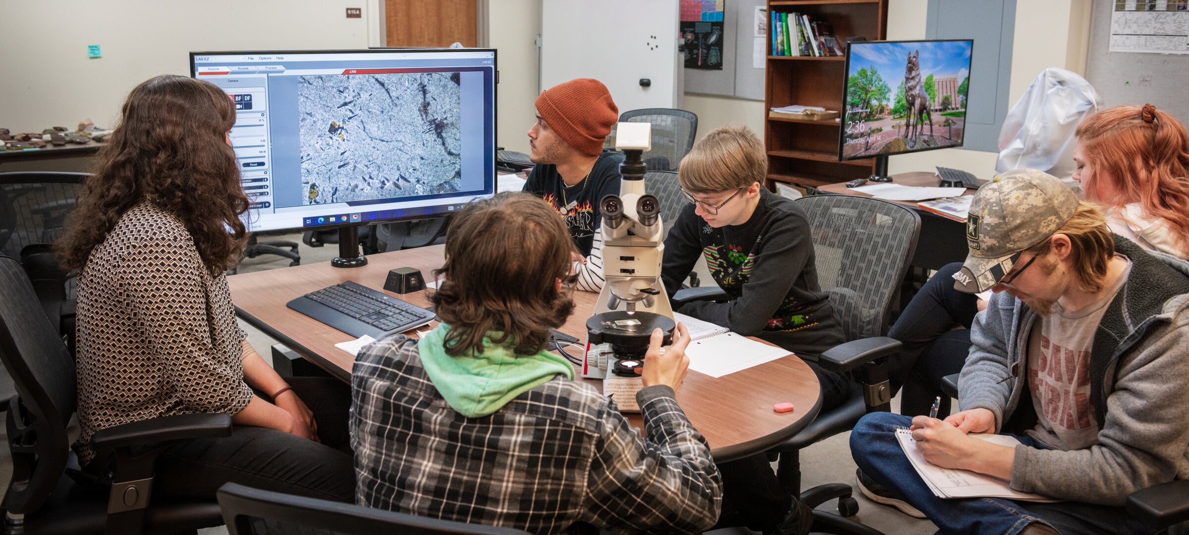 A group of students around a table studying
