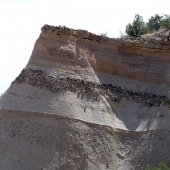 Sandstone cliff showing rock layers.