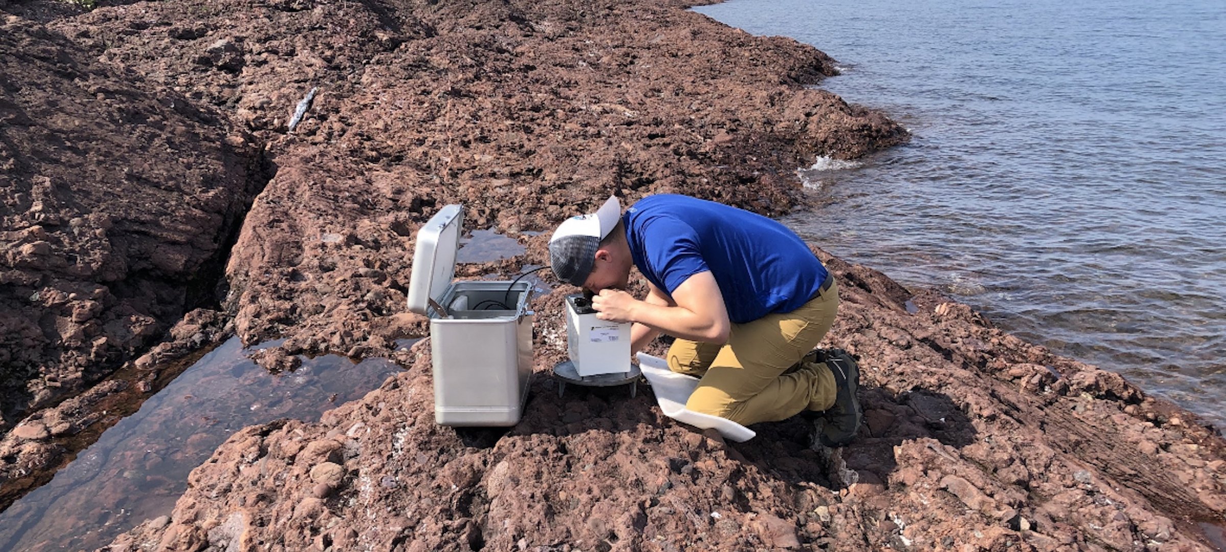 Student researcher on a rockbed in Lake Superior.