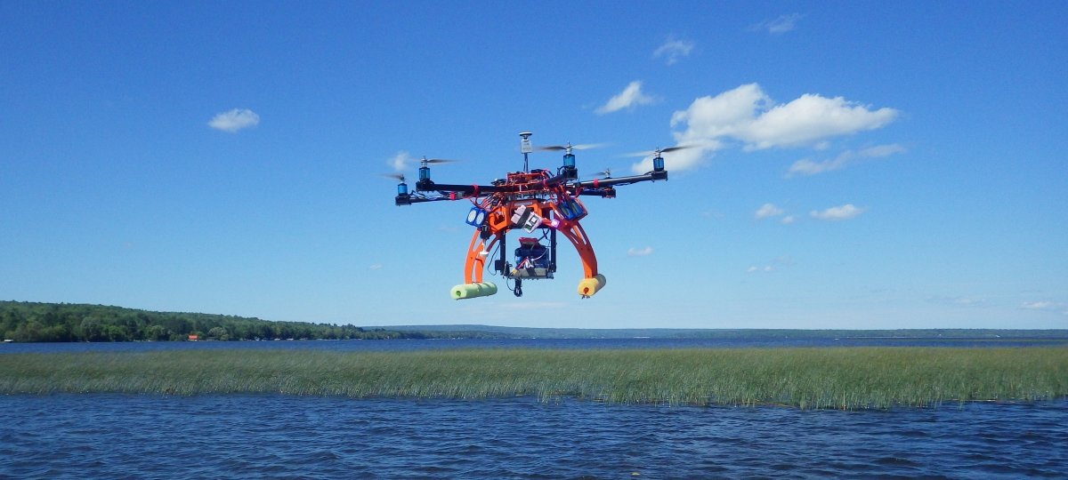 Drone flying above the water.