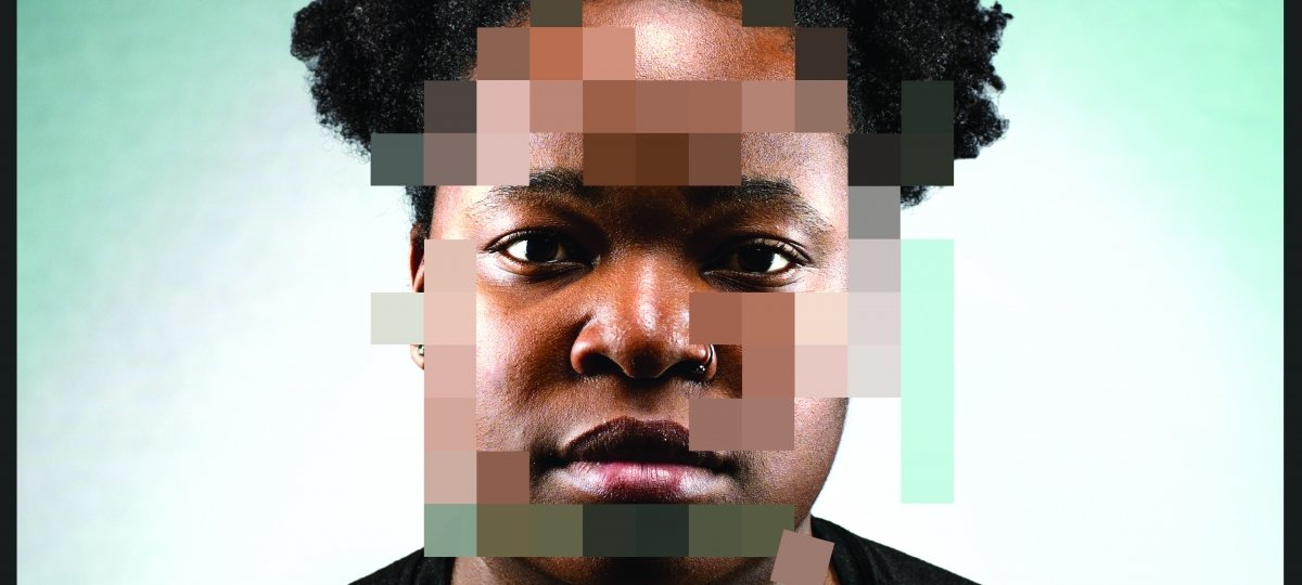 Person with blurred squares over their face.