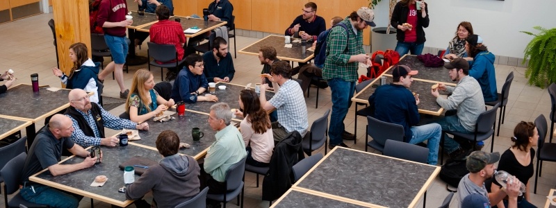 Michigan Tech faculty and staff chat in the Forestry building.