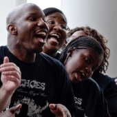 A man sings in an a capella choir.