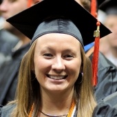 A woman in a graduation cap.