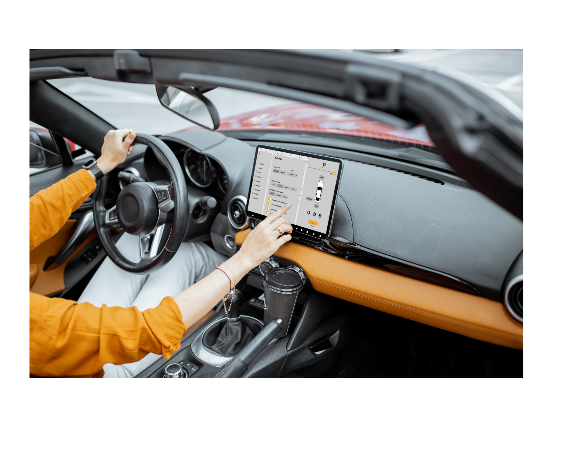 Female driver touching a control panel in a modern car