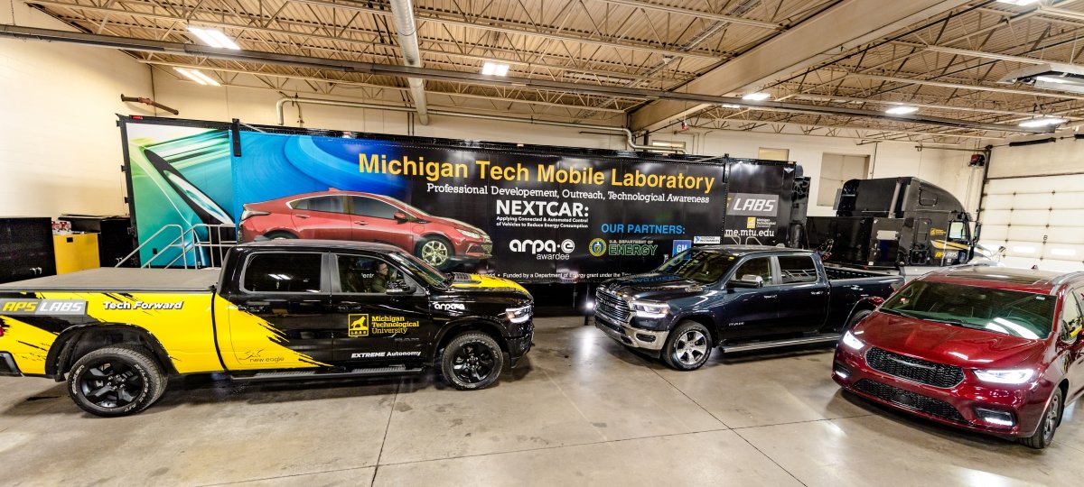 The APS Mobile Lab surrounded by test vehicles.