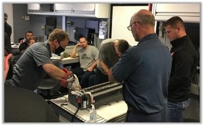 Participants tear down a battery in this APS LABS class.