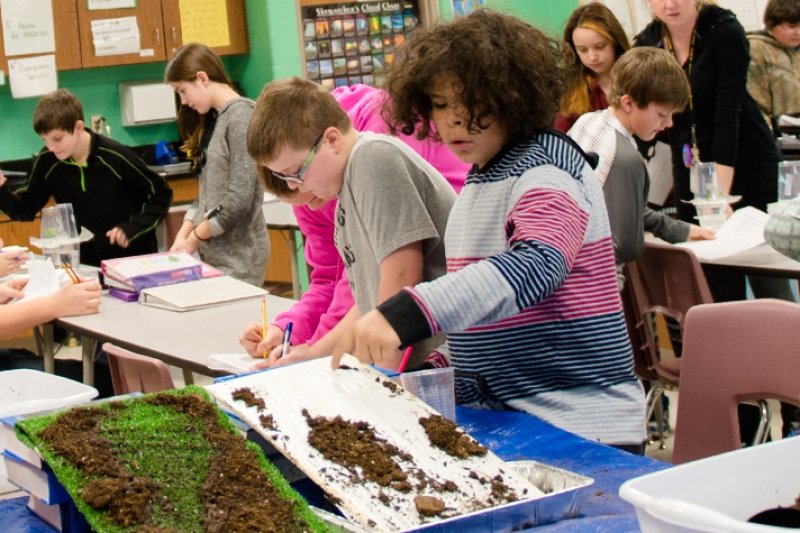 Young students conducting science experiments in the classroom.