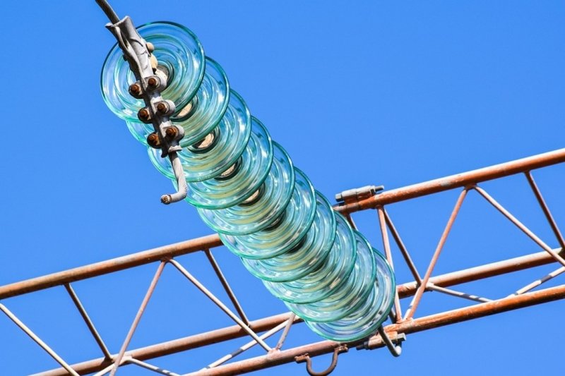 Close up of a glass breaker on an electric power line.