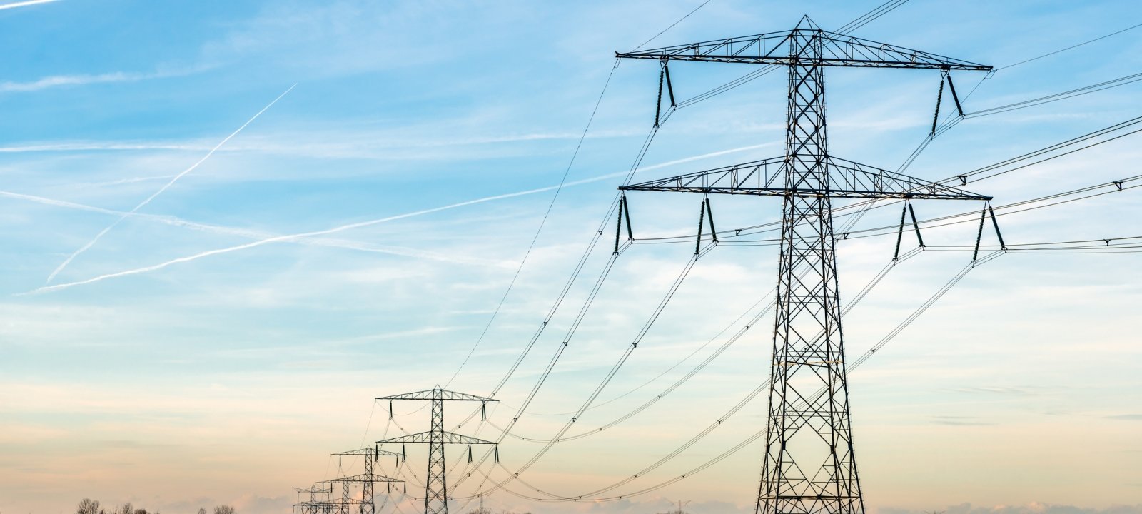 Electric power lines against a blue sky.