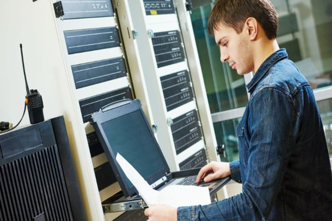 Young cybersecurity professional working on a problem.