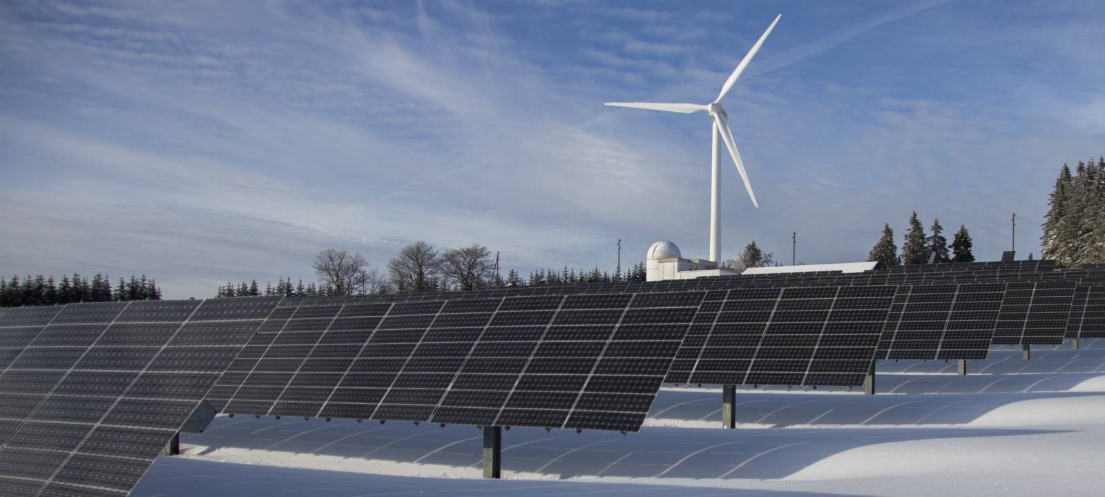 Wind Turbines working in the snow, on a Winter's day.