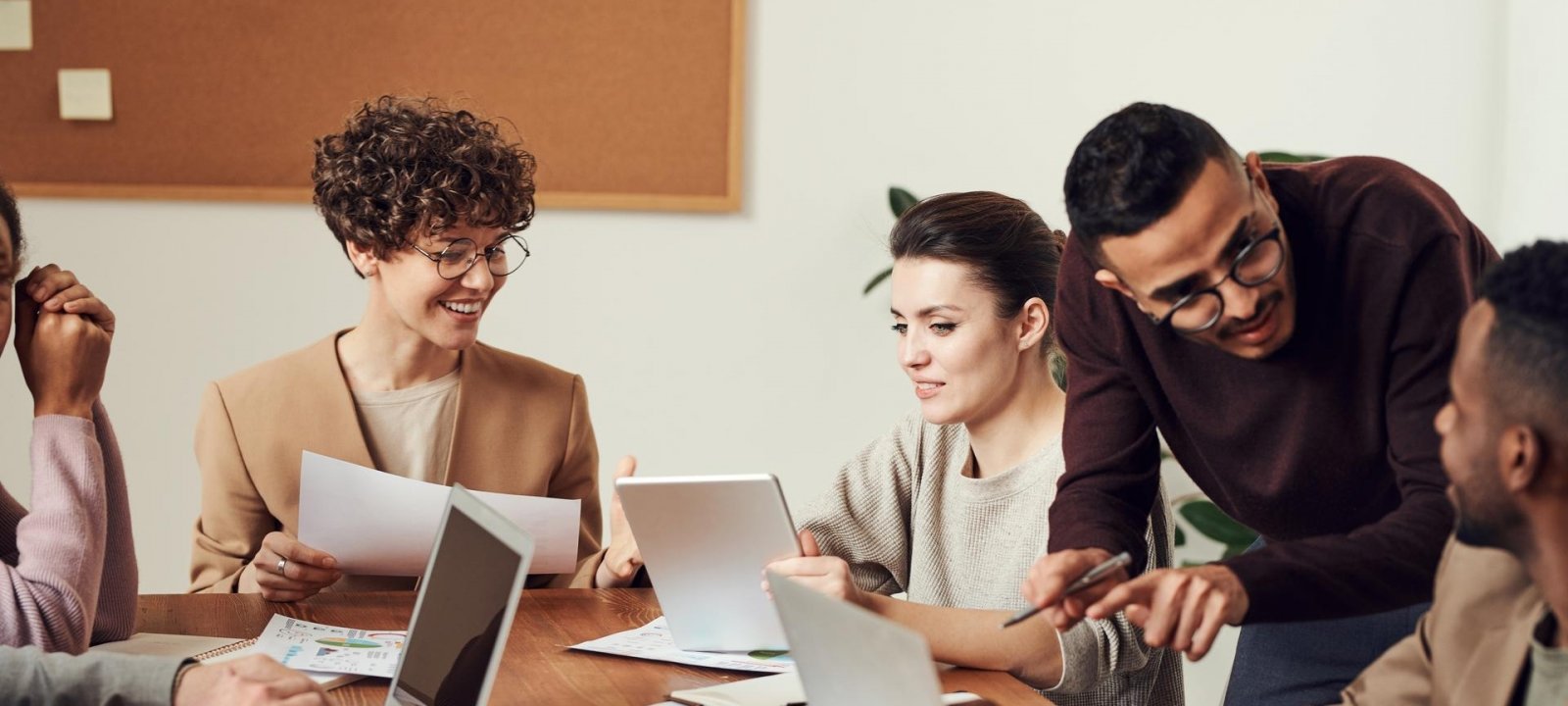 Professionals at a computer working.